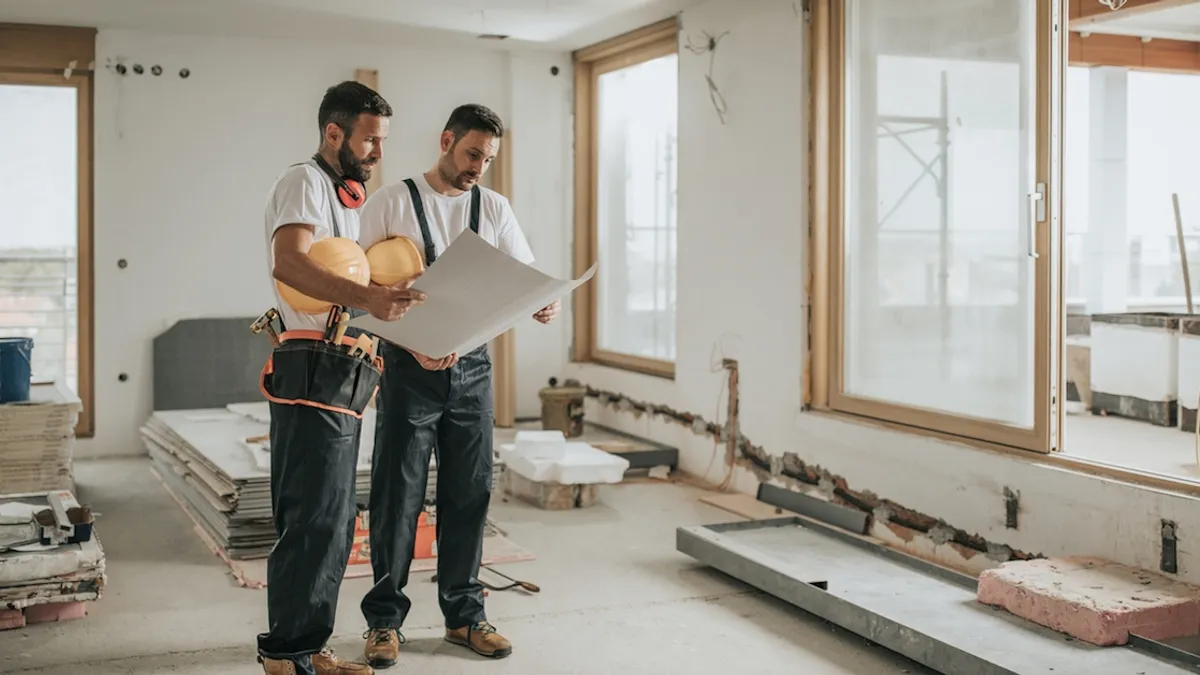 Two men who are planning to rebuild the house